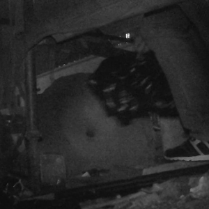Homeless man camping at the construction site