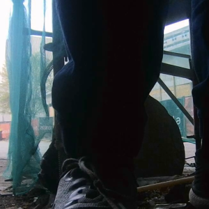 Several men peeing in the corner