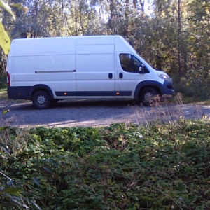 What’s going on behind that van?