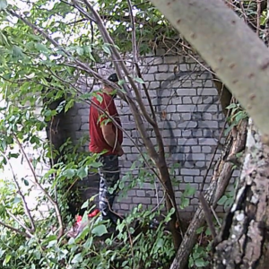 More men marking the brick wall
